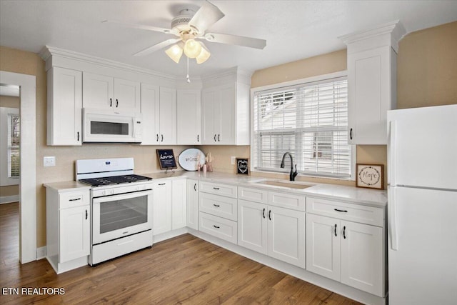 1231 Jefferson Ave, Maryville, TN 37804 - kitchen featuring white appliances, light countertops, a sink, and white cabinets