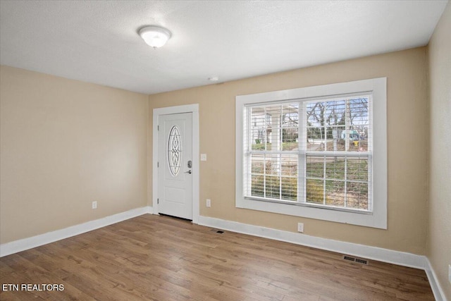 1231 Jefferson Ave, Maryville, TN 37804 - foyer entrance with visible vents, a textured ceiling, baseboards, and wood finished floors
