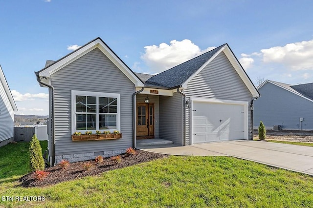 view of front of property featuring a garage and a front yard