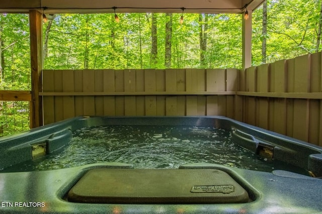 exterior space featuring a hot tub