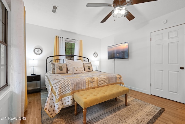 bedroom featuring ceiling fan and light hardwood / wood-style flooring