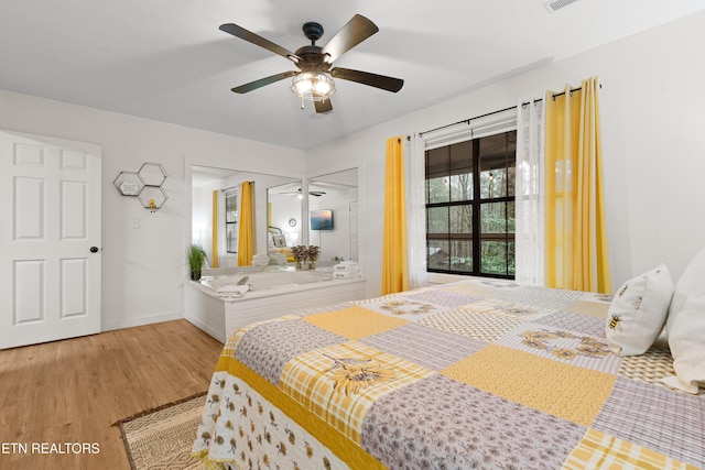 bedroom featuring ceiling fan and light hardwood / wood-style floors