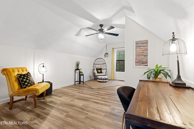 office area with hardwood / wood-style flooring, ceiling fan, and vaulted ceiling