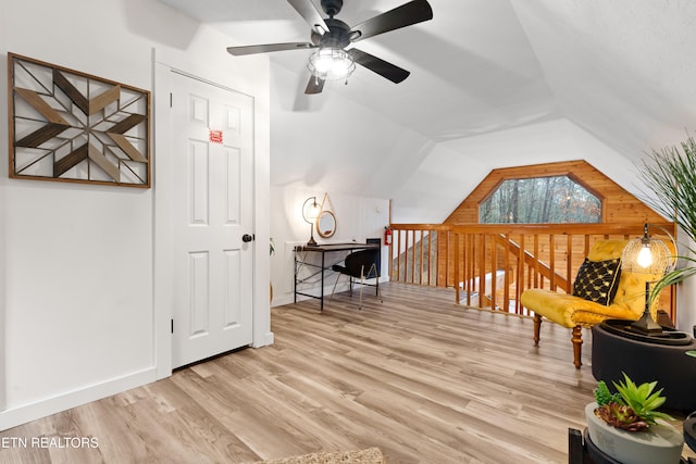 sitting room featuring light wood-type flooring and lofted ceiling