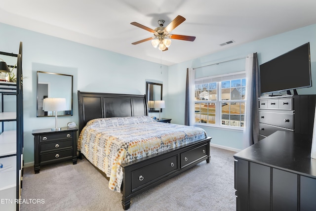 bedroom with light carpet and ceiling fan