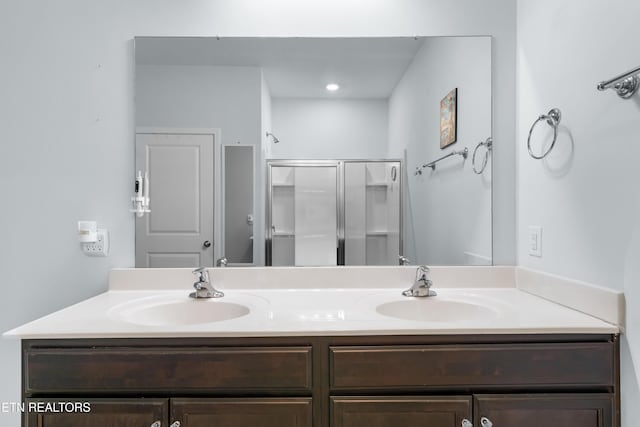 bathroom with vanity and an enclosed shower