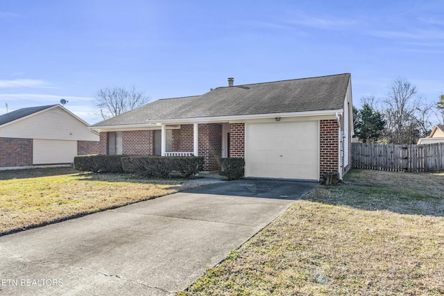 ranch-style house with a garage and a front lawn