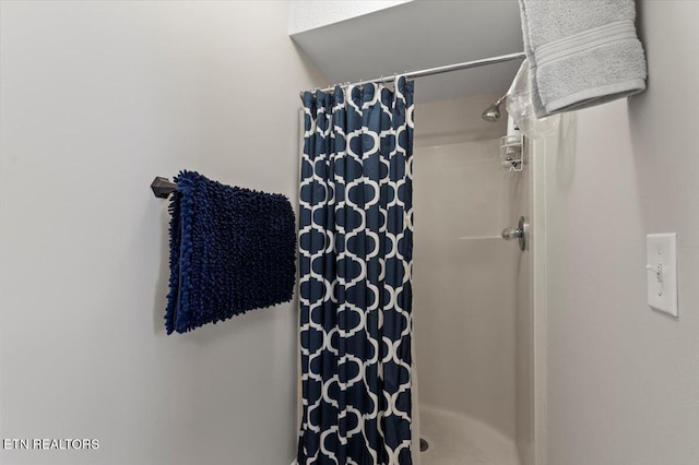 bathroom with a shower with shower curtain