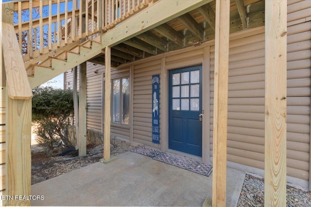 entrance to property featuring a patio area