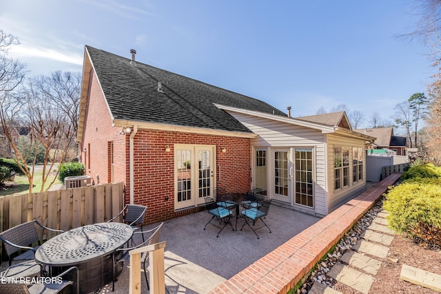 rear view of house featuring a patio area and french doors