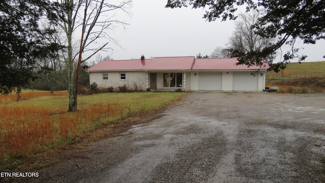 ranch-style home featuring a garage