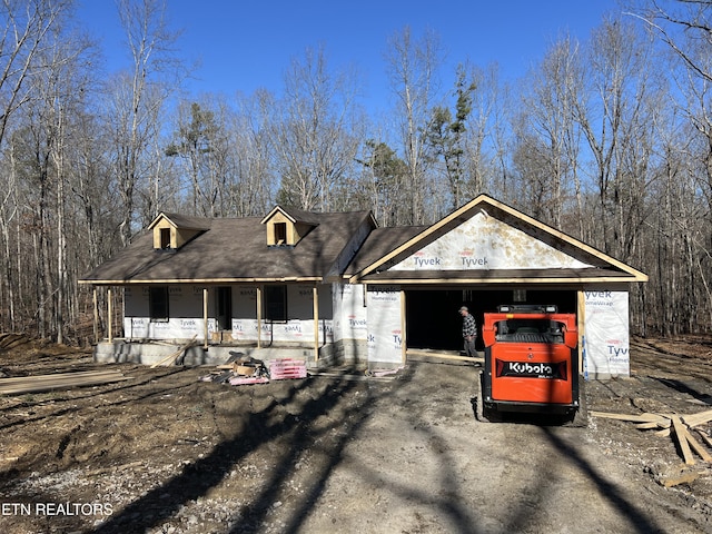 view of front of house with a garage and covered porch