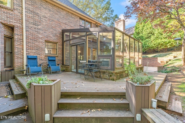 wooden terrace with a sunroom