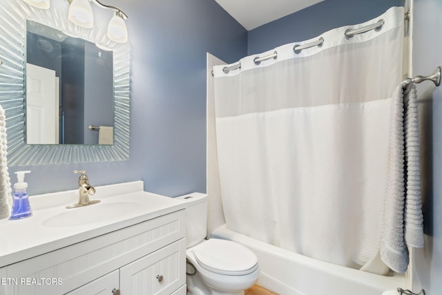 full bathroom with shower / bath combination with curtain, vanity, and toilet