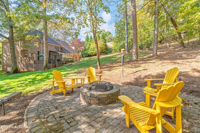 view of patio with a fire pit