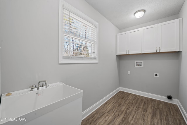 laundry room with dark hardwood / wood-style floors, sink, cabinets, washer hookup, and electric dryer hookup