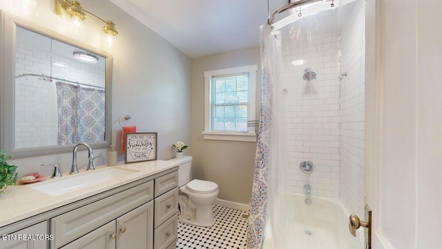 full bathroom with vanity, toilet, and shower / bath combo