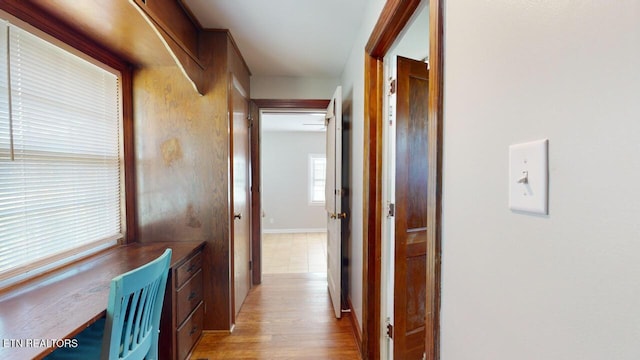 hallway with light wood-type flooring