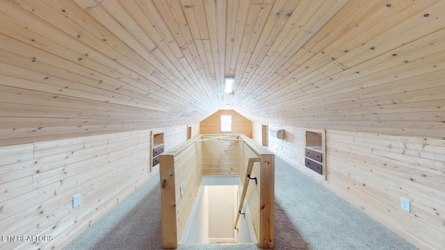 additional living space with vaulted ceiling, carpet floors, wood ceiling, and wooden walls