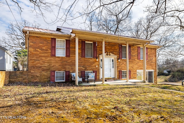 rear view of property with a patio