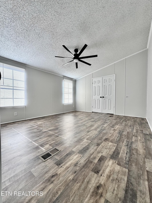 unfurnished room with crown molding, hardwood / wood-style floors, a textured ceiling, and ceiling fan