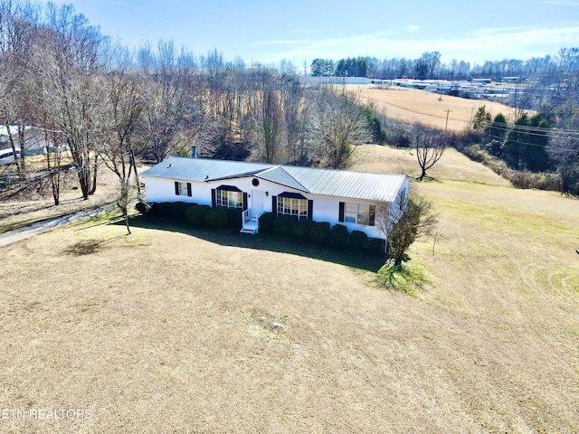 view of front of home featuring a front yard and a rural view