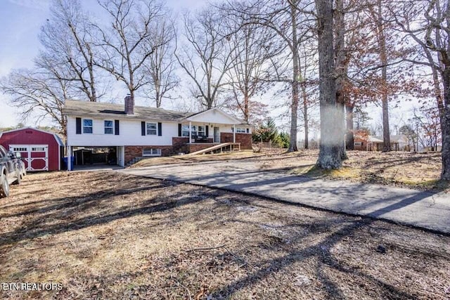 view of front of property with a storage shed and a porch