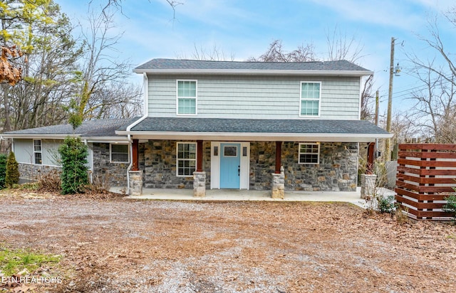 front of property featuring a patio area and a porch