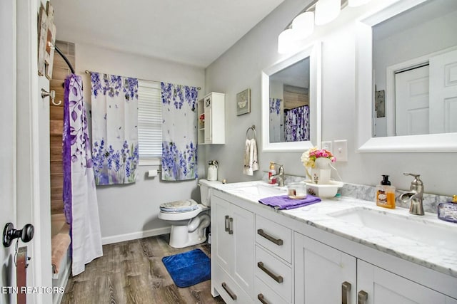 bathroom with vanity, hardwood / wood-style flooring, toilet, and a shower with shower curtain