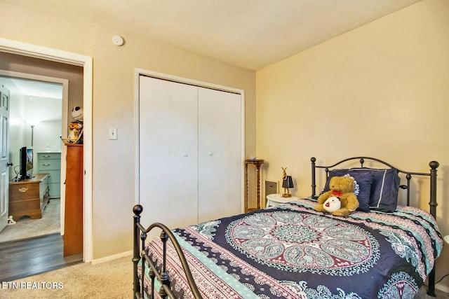 carpeted bedroom featuring a closet