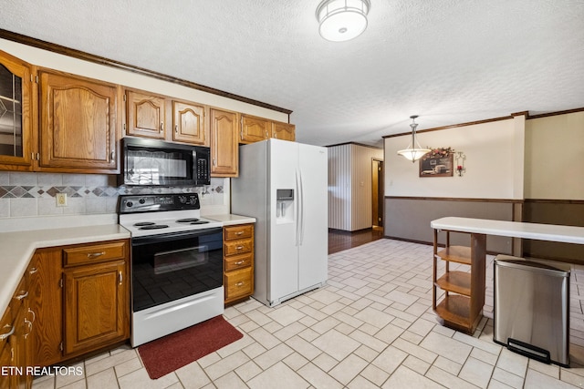 kitchen featuring electric stove, hanging light fixtures, white refrigerator with ice dispenser, ornamental molding, and a textured ceiling