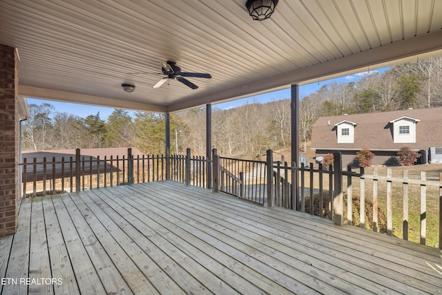 wooden deck featuring ceiling fan