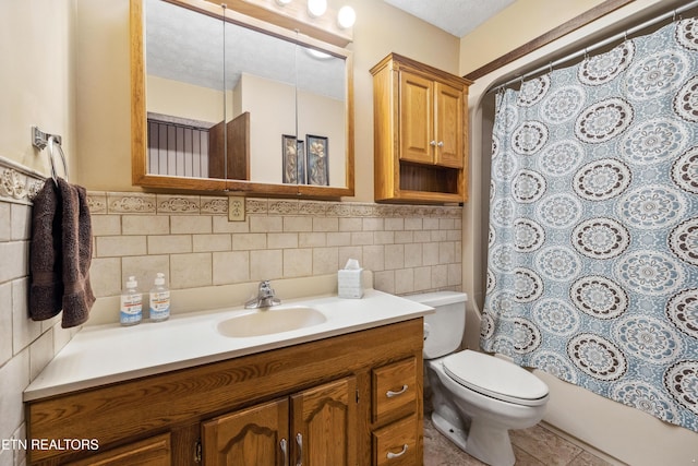 full bathroom featuring shower / bathtub combination with curtain, tile walls, vanity, a textured ceiling, and toilet