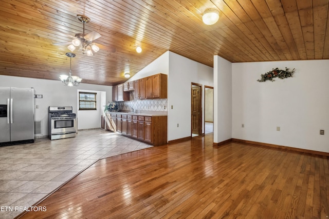 unfurnished living room featuring ceiling fan with notable chandelier, light hardwood / wood-style flooring, wooden ceiling, and vaulted ceiling