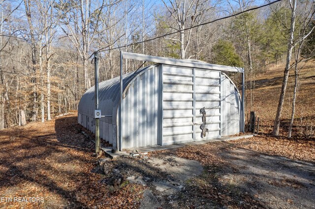 view of outdoor structure with a garage