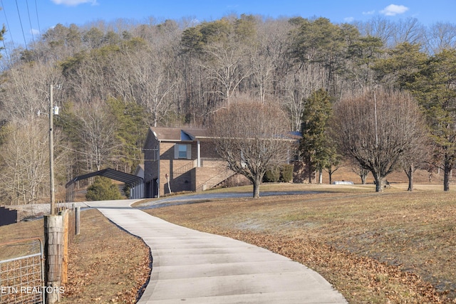 view of home's community featuring a yard