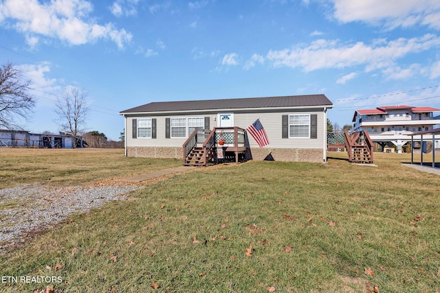 manufactured / mobile home with a front lawn