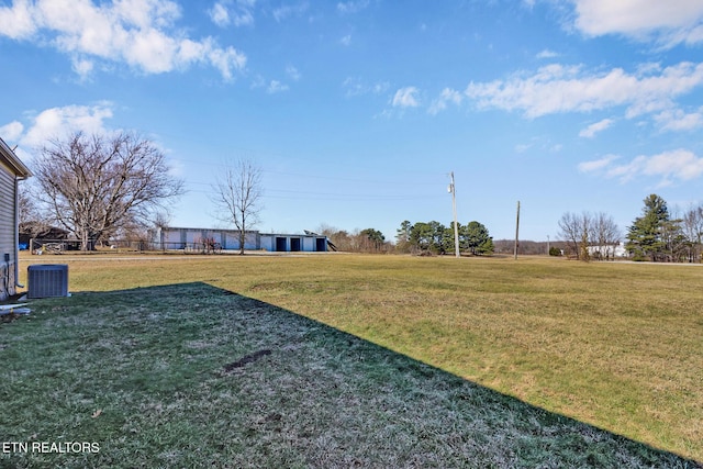 view of yard with central AC unit