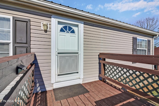 entrance to property with a wooden deck