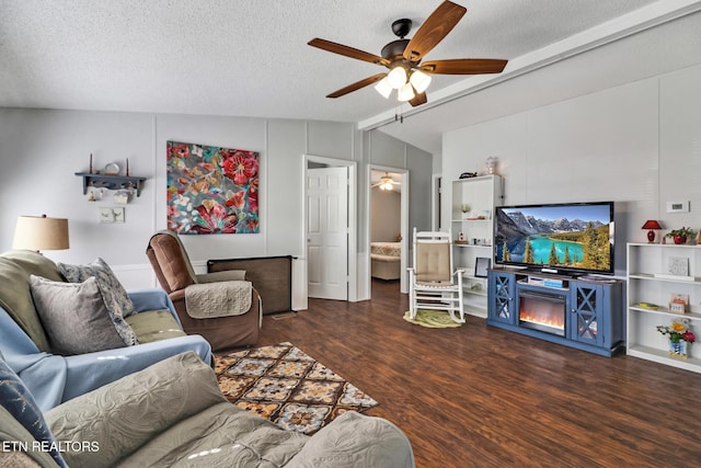 living room featuring ceiling fan, lofted ceiling with beams, dark hardwood / wood-style floors, and a textured ceiling