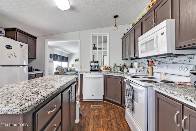 kitchen with white appliances, dark wood-type flooring, hanging light fixtures, dark brown cabinetry, and a textured ceiling