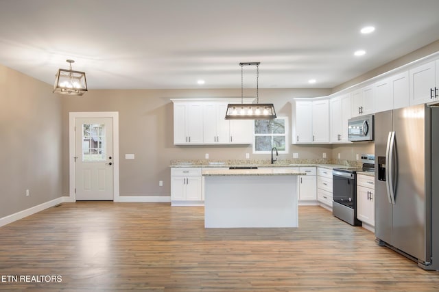 kitchen with recessed lighting, appliances with stainless steel finishes, and light wood-type flooring