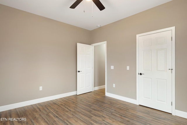 unfurnished bedroom featuring baseboards, ceiling fan, and wood finished floors