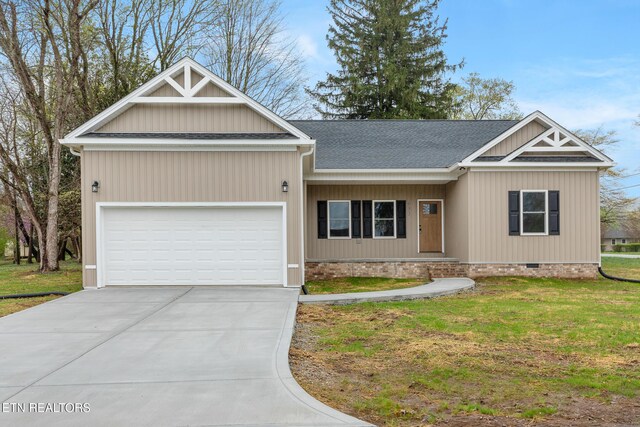 view of front of home featuring crawl space, driveway, a front yard, a garage, and a shingled roof