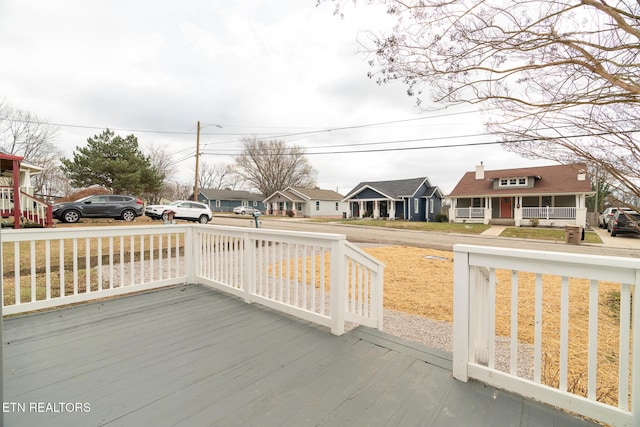 wooden terrace featuring covered porch