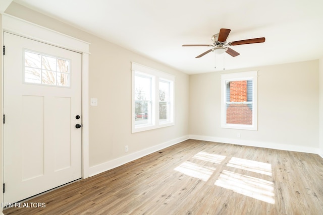 foyer entrance featuring ceiling fan and light hardwood / wood-style floors