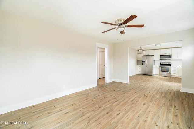 unfurnished living room with ceiling fan and light hardwood / wood-style flooring