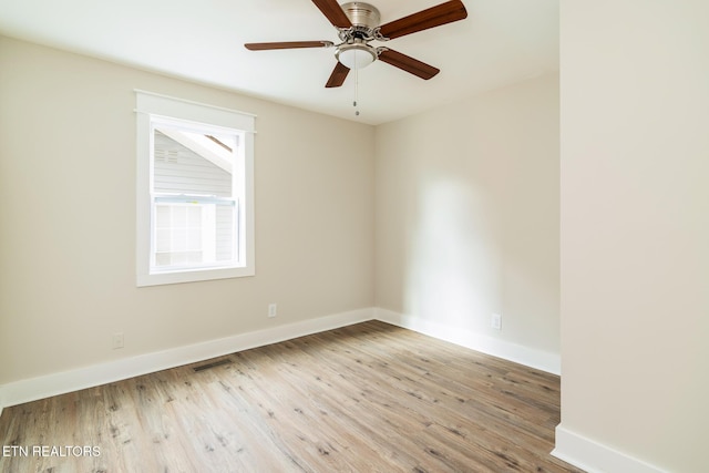 unfurnished room featuring ceiling fan and light hardwood / wood-style floors