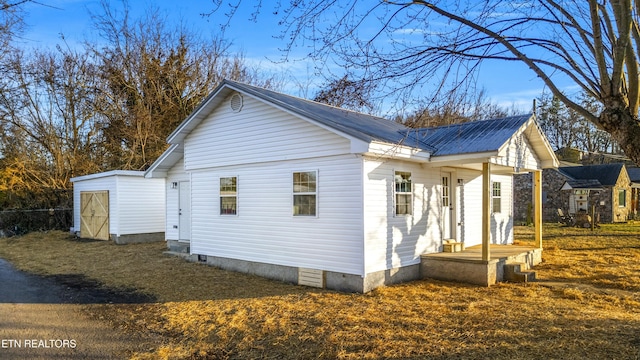 view of side of property with a storage shed