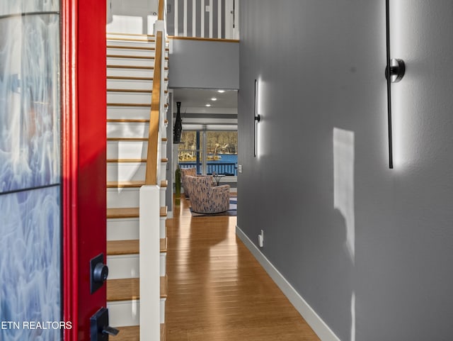 hallway with wood-type flooring